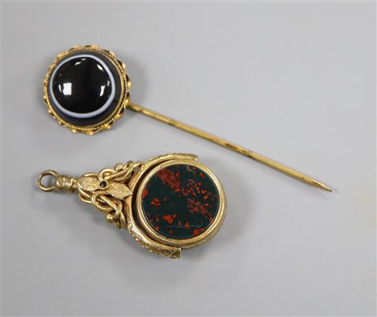 A Victorian pinchbeck, sardonyx and bloodstone set spinning fob seal and a similar banded agate set stick pin.